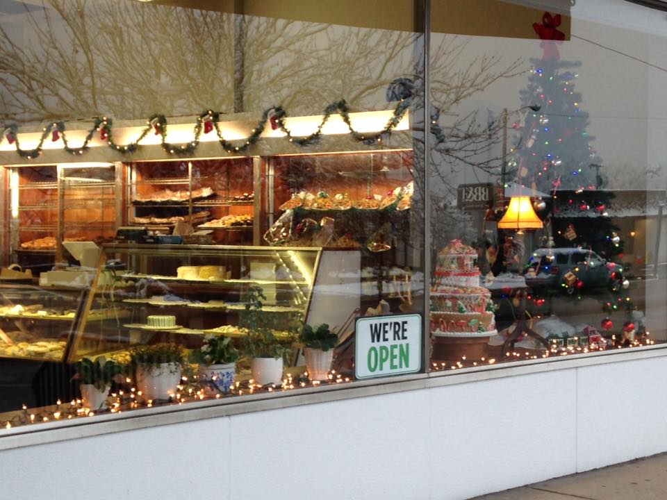 The bakery's Christmas window display full of cakes and gingerbread